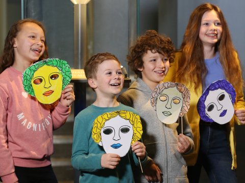 Image: Children in the museum with masks they have made