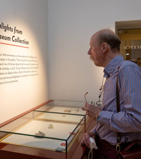 A man looking at a display