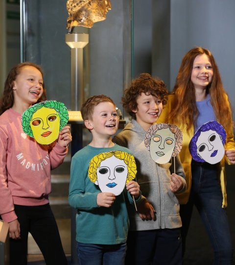 Image: Children in the museum with masks they have made