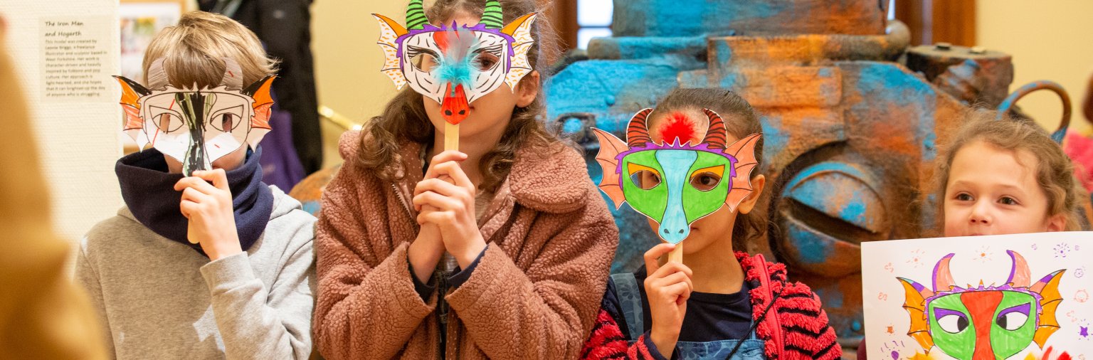 Image: Children with masks they've made