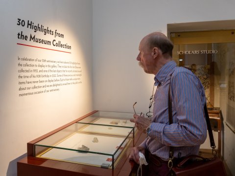 A man looking at a display